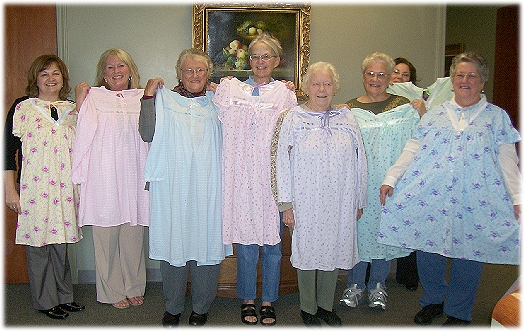 The committee models the modified gowns! Edith is fifth from left.